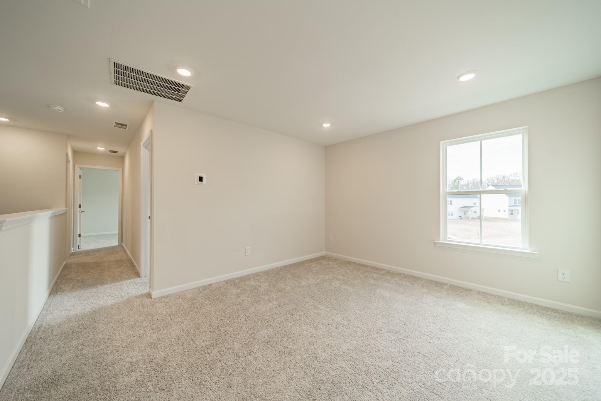6012 Chumbley Pt Road Charlotte, NC 28215 - Photo 26 of 46 an empty room with windows and closet