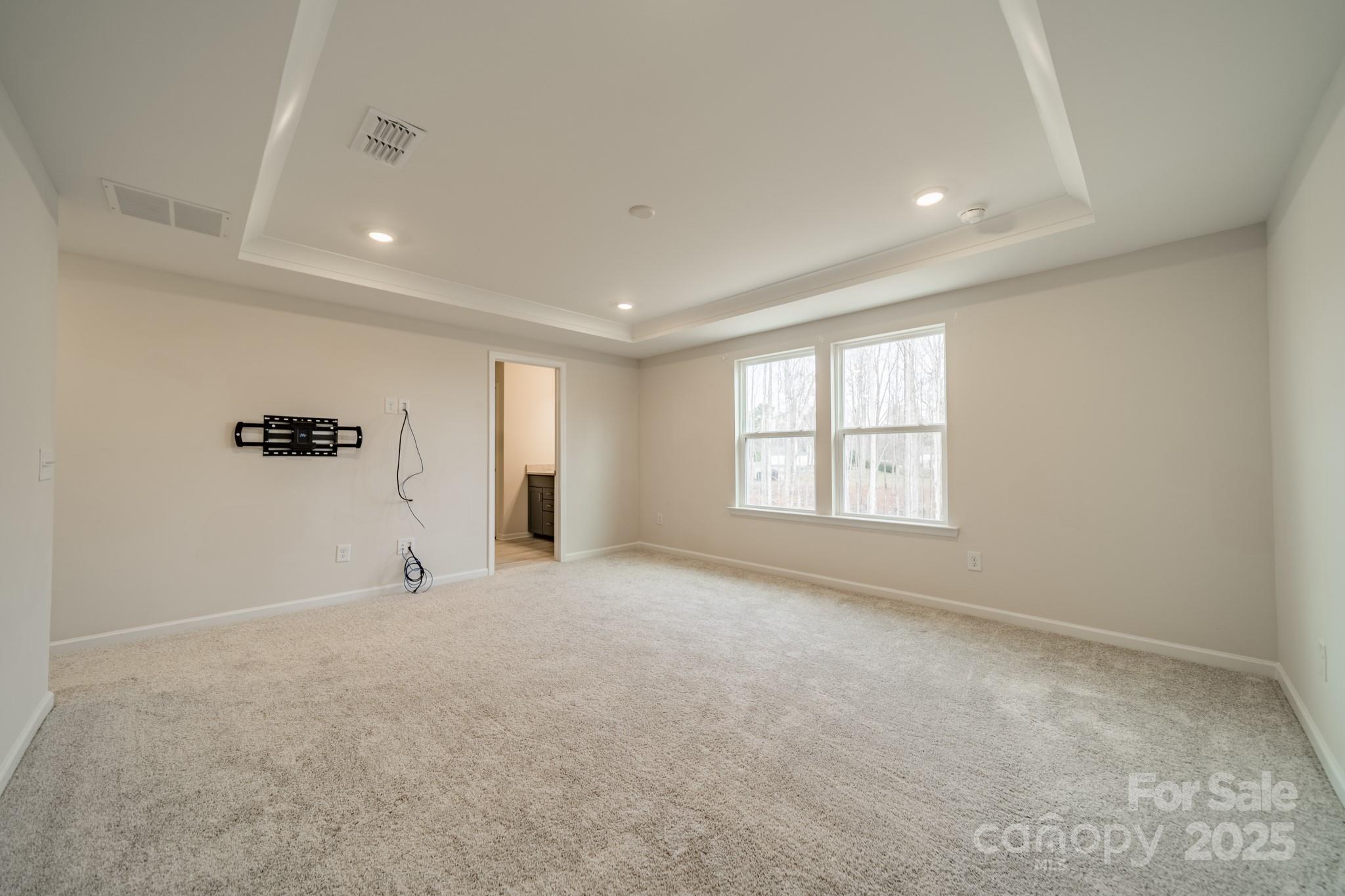 6012 Chumbley Pt Road Charlotte, NC 28215 - Photo 30 of 46 a view of a big room with windows and chandelier fan