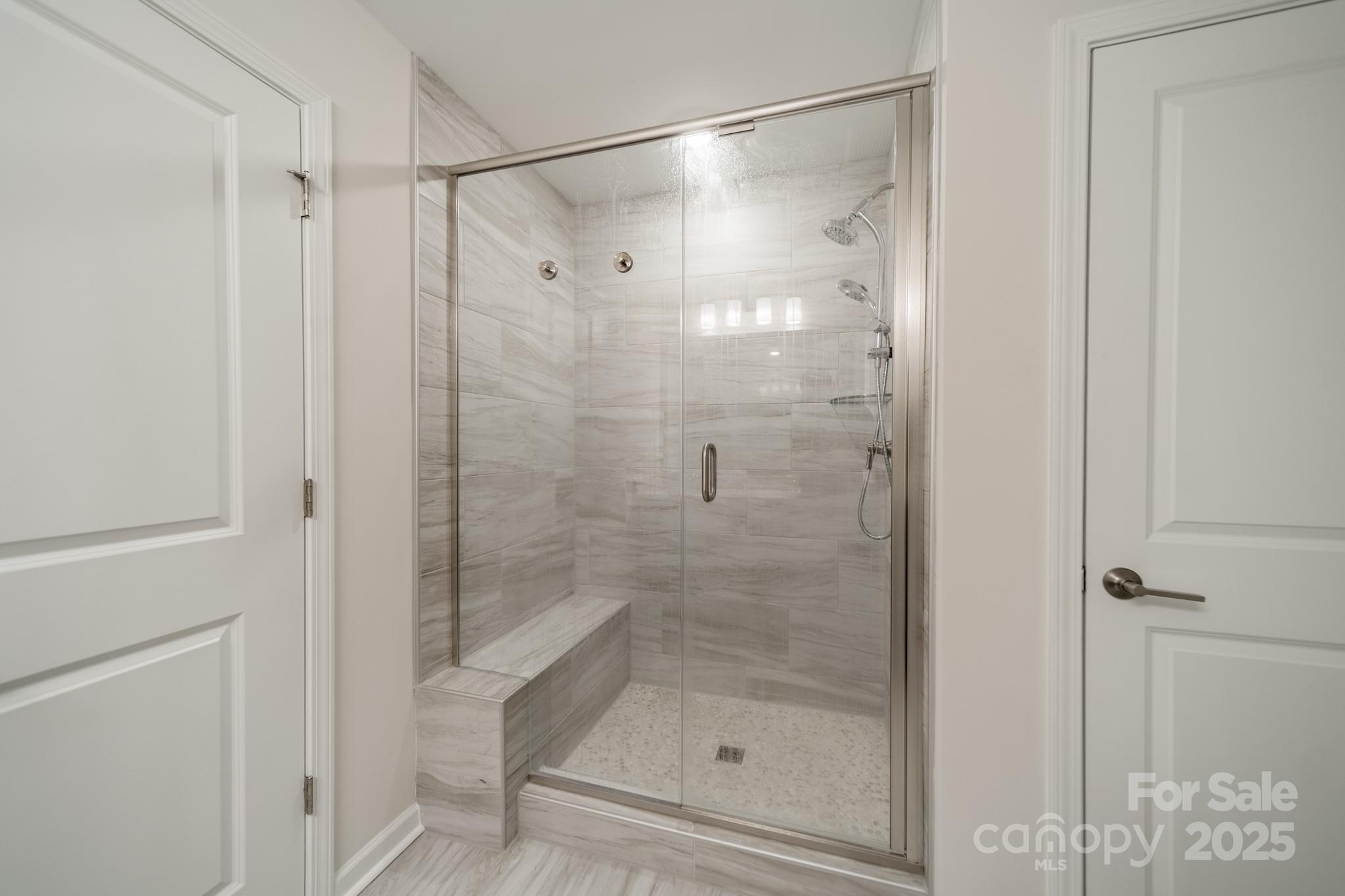 6012 Chumbley Pt Road Charlotte, NC 28215 - Photo 33 of 46 a bathroom with a glass shower door