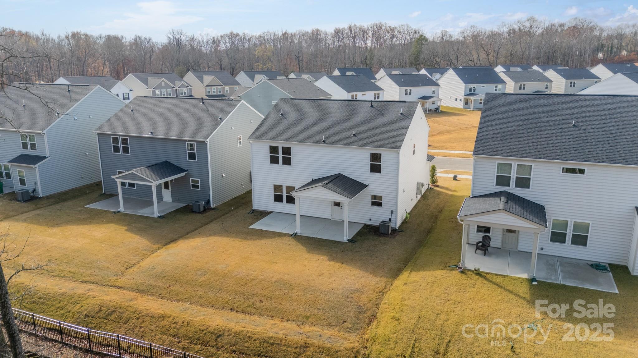 6012 Chumbley Pt Road Charlotte, NC 28215 - Photo 38 of 46 an aerial view of a house with swimming pool in front of it