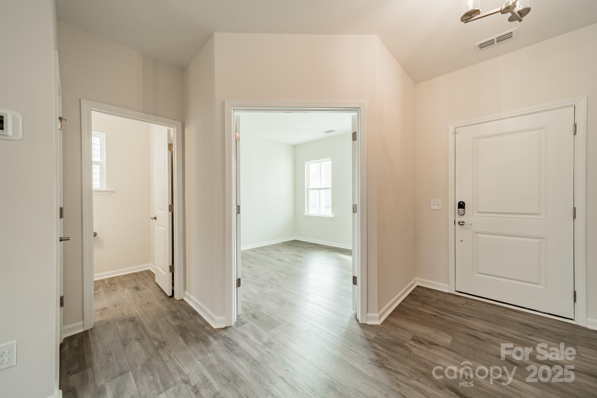 6012 Chumbley Pt Road Charlotte, NC 28215 - Photo 4 of 46 wooden floor & windows in a room