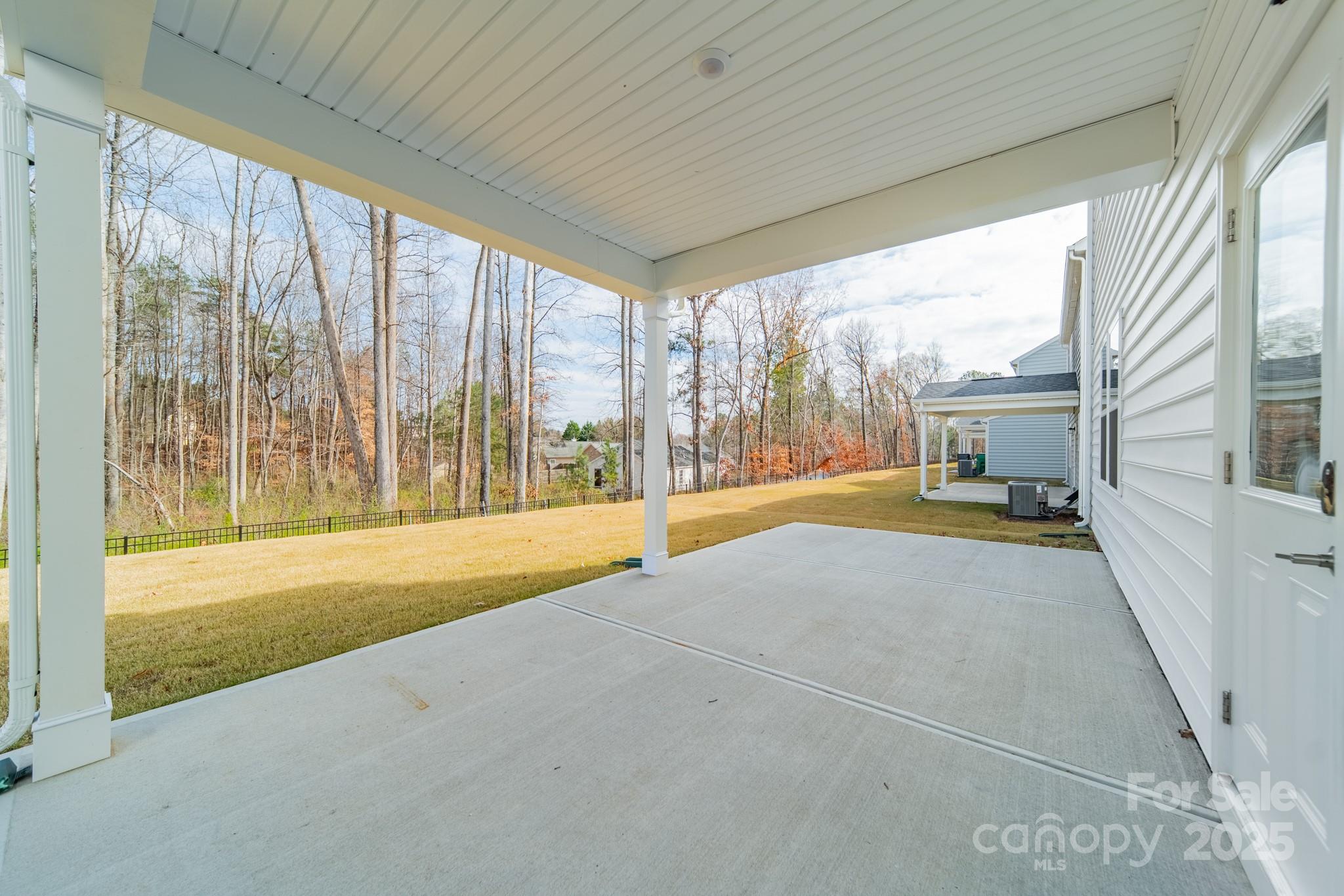 6012 Chumbley Pt Road Charlotte, NC 28215 - Photo 44 of 46 a view of an empty room with a fireplace and a large window