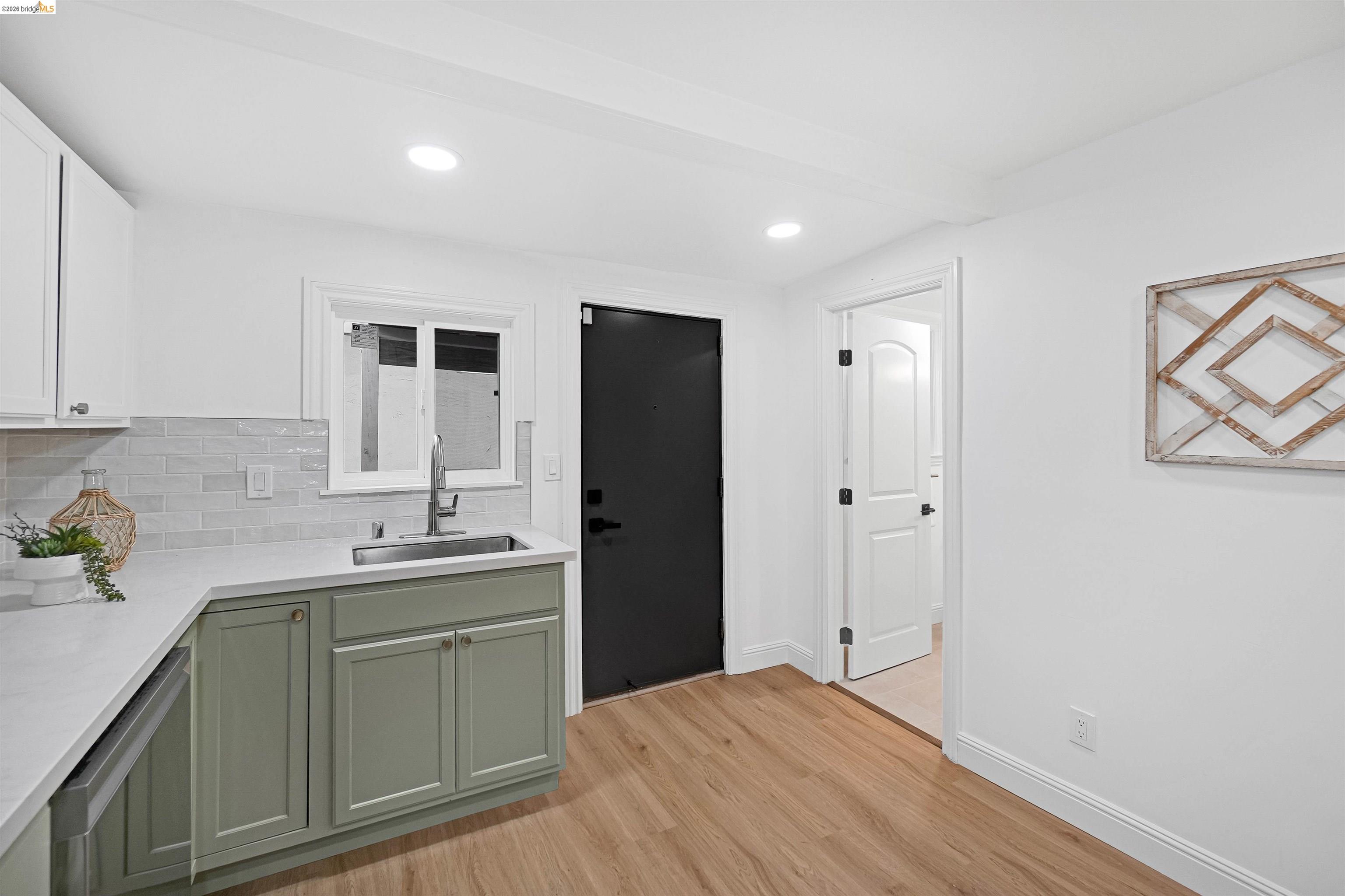 1812 Woolsey Street Berkeley, CA 94703 - Photo 13 of 48 Kitchenette featuring wood-finish flooring, recessed lighting, and white walls