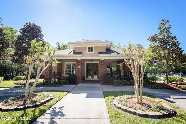 a front view of a building with garden