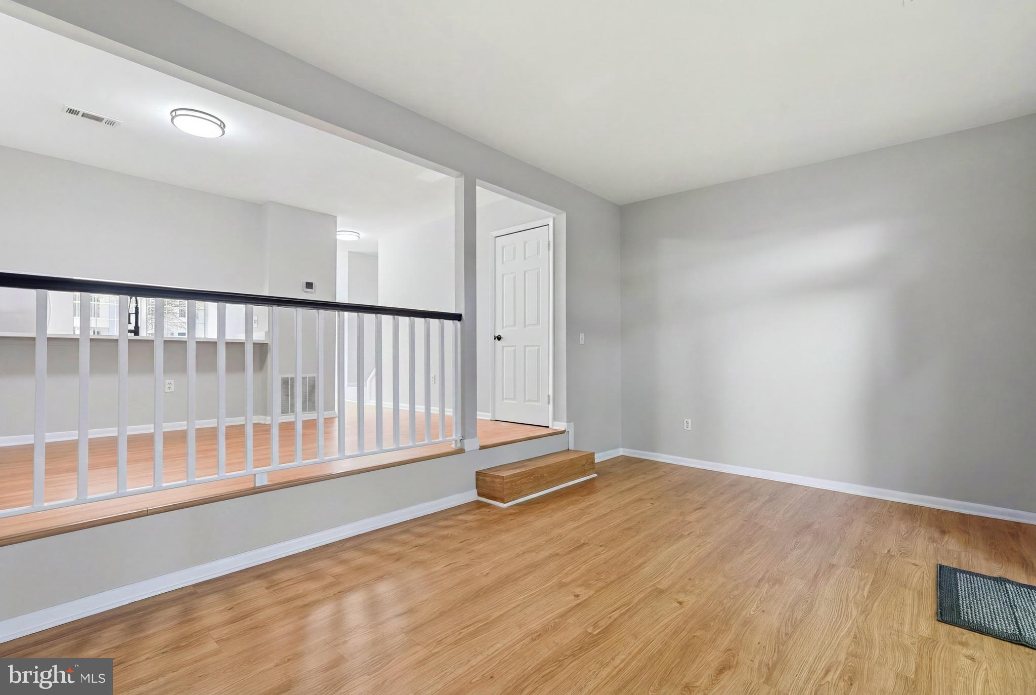 3682 Masthead Trail Triangle, VA 22172 - Photo 16 of 53 a view of an empty room with wooden floor