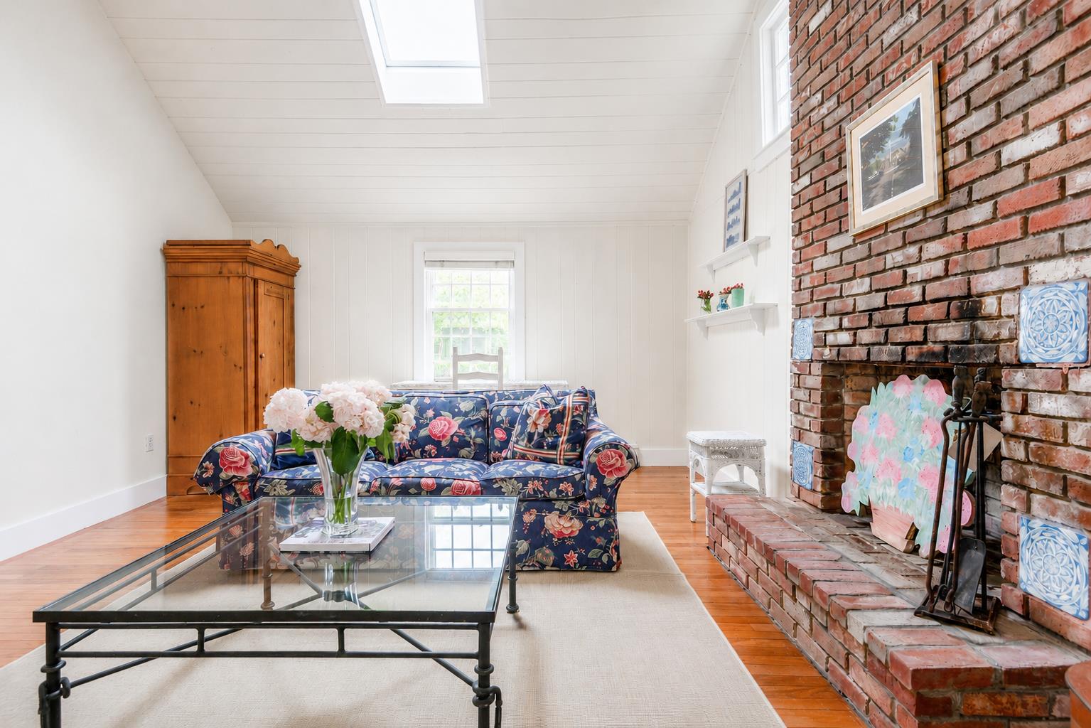 12 King Street Nantucket, MA 02554 - Photo 13 of 32 a living room with furniture and flowers