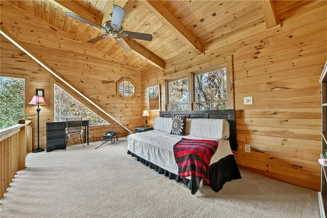 a bedroom with furniture and a window
