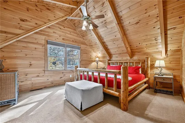 a bedroom with furniture and a window