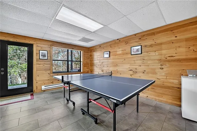 a backyard of a house with barbeque oven table and chairs