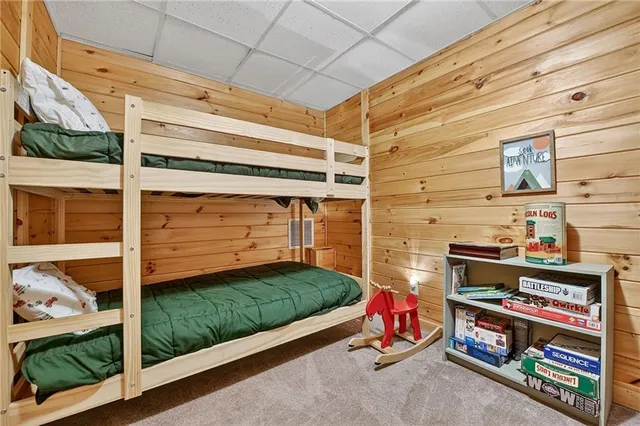 a view of a patio with a table chairs and a backyard