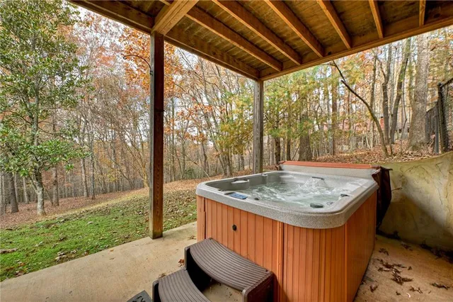 a view of roof deck with table and chairs and wooden floor
