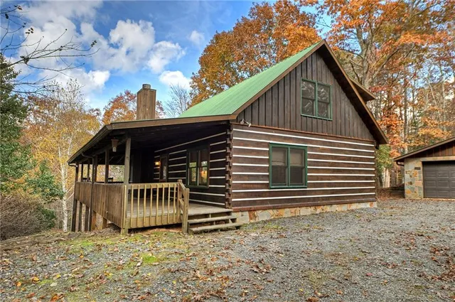 a view of a house with a yard and wooden roof