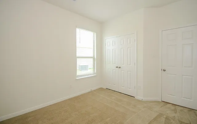 a view of kitchen with kitchen island granite countertop a stove top oven a sink and a granite counter top
