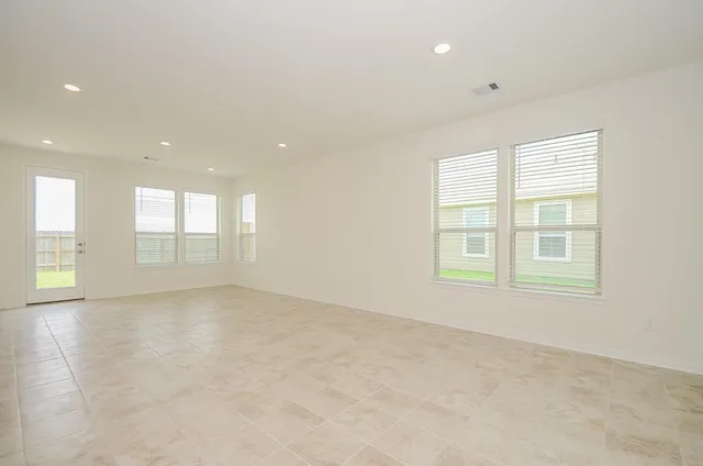 a kitchen with granite countertop a sink and a stove top oven
