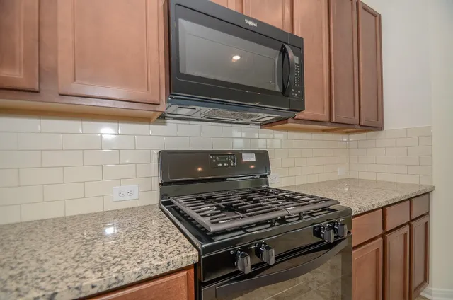 a view of a hallway with closet and a bathroom