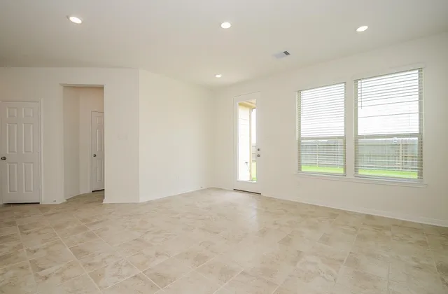 a view of a backyard with plants and a garden