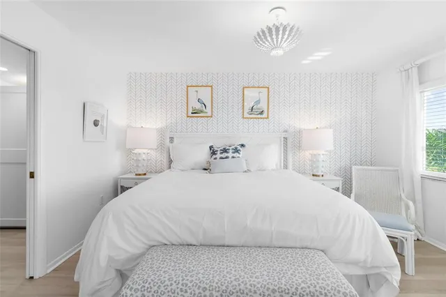 a large white bed in a white room