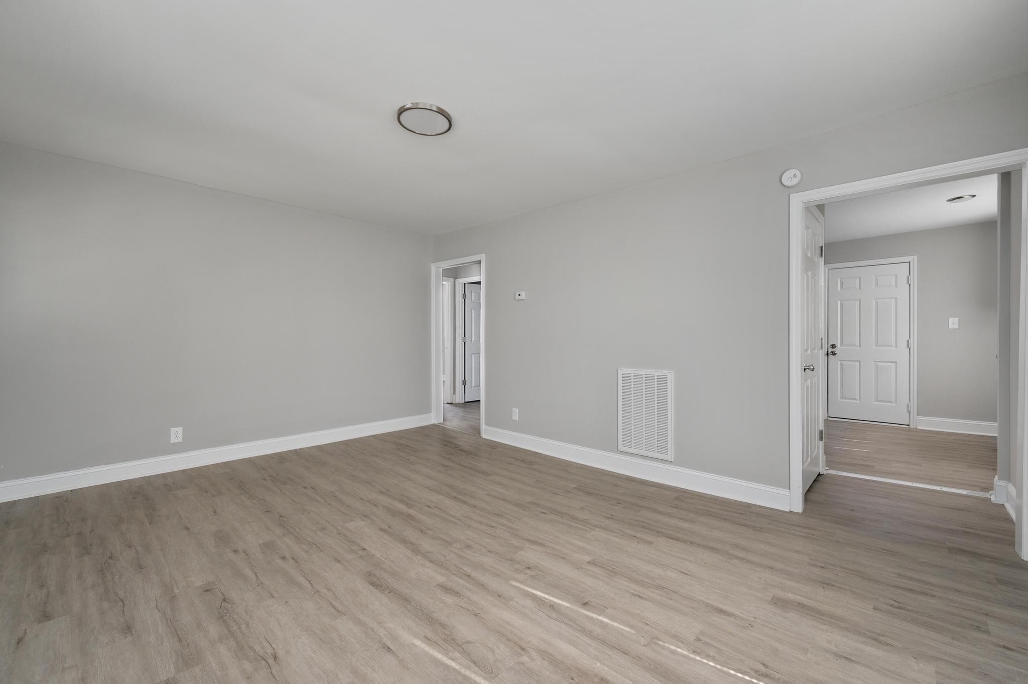 1024 Richard Street Springfield, TN 37172 - Photo 13 of 16 a view of an empty room with wooden floor