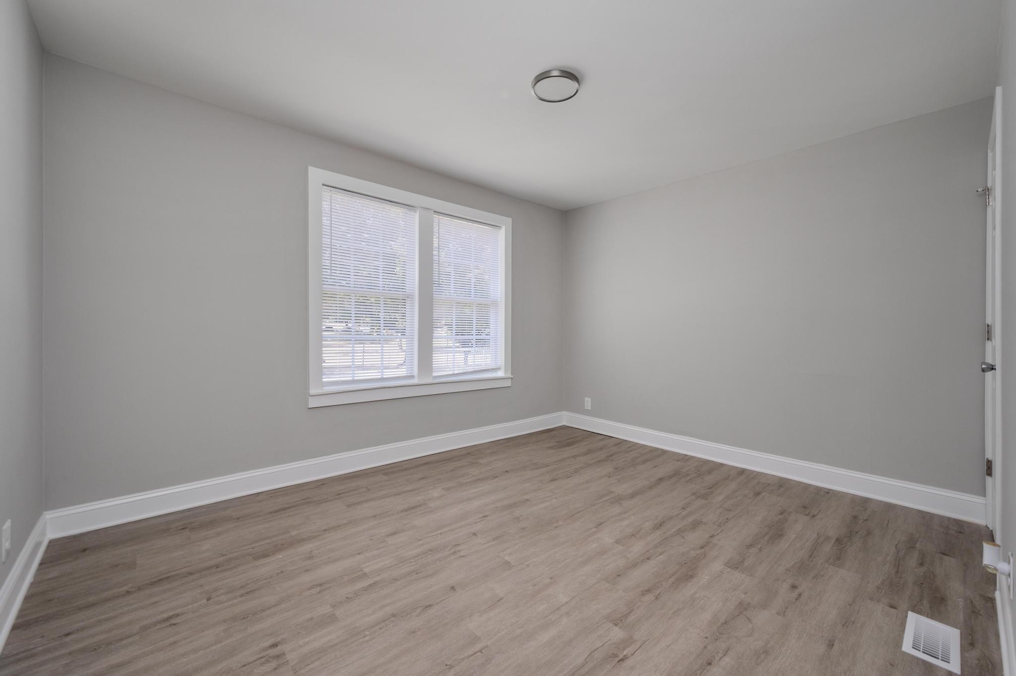 1024 Richard Street Springfield, TN 37172 - Photo 16 of 16 a view of an empty room with wooden floor and a window