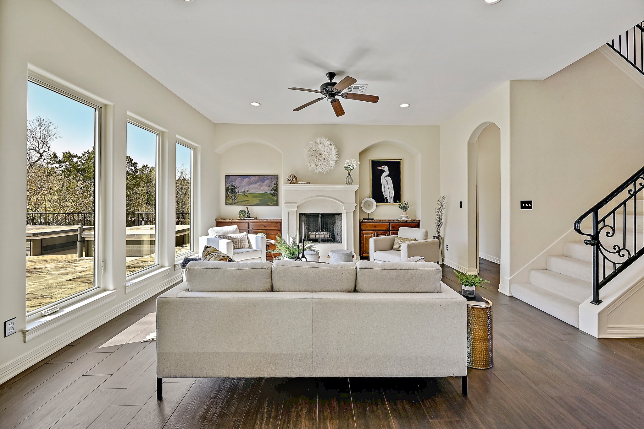 13201 Winding Creek Road Austin, TX 78736 - Photo 11 of 39 a living room with fireplace furniture and a large window