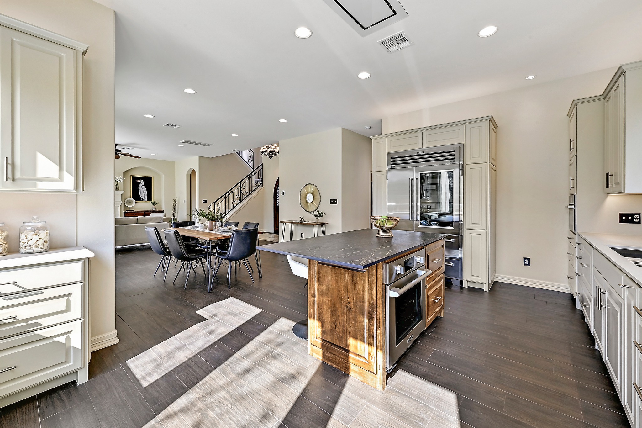 13201 Winding Creek Road Austin, TX 78736 - Photo 12 of 39 a kitchen with stainless steel appliances granite countertop a stove and a refrigerator