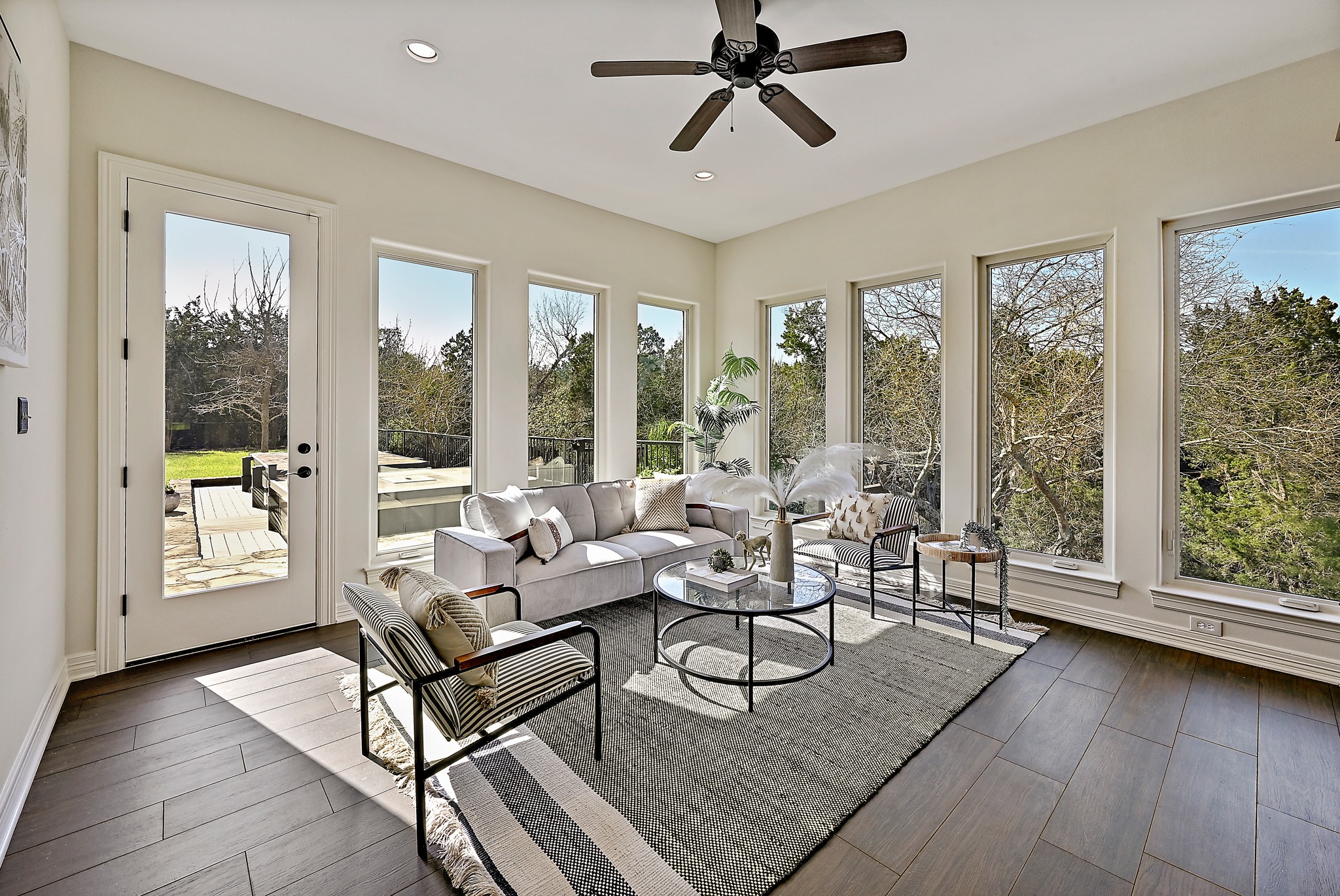 13201 Winding Creek Road Austin, TX 78736 - Photo 13 of 39 a living room with furniture and a large window