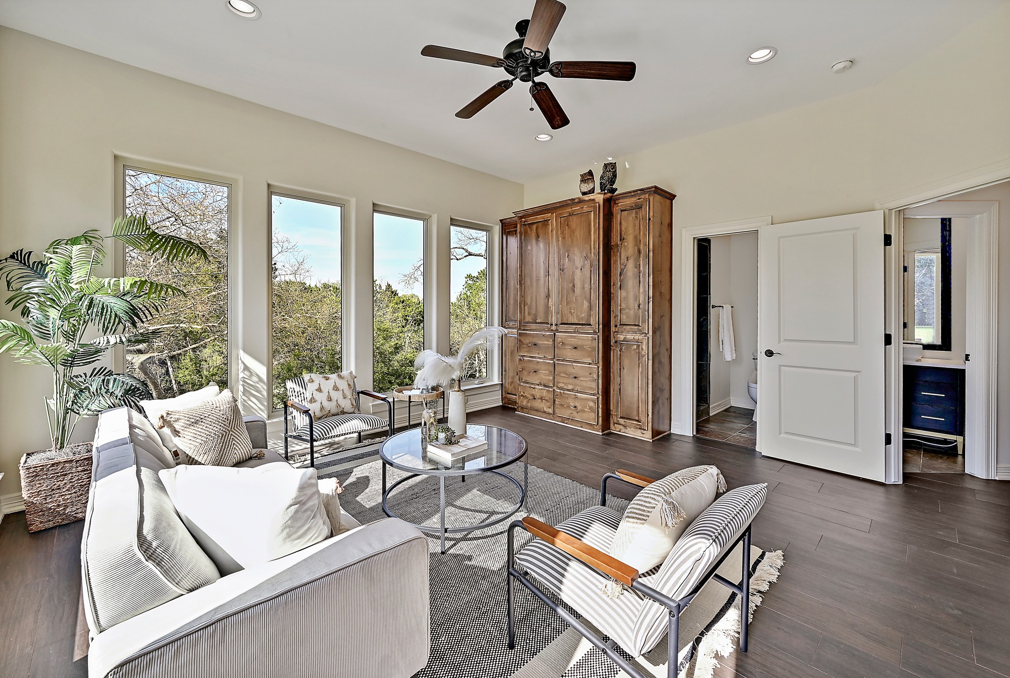 13201 Winding Creek Road Austin, TX 78736 - Photo 14 of 39 a living room with furniture and a large window
