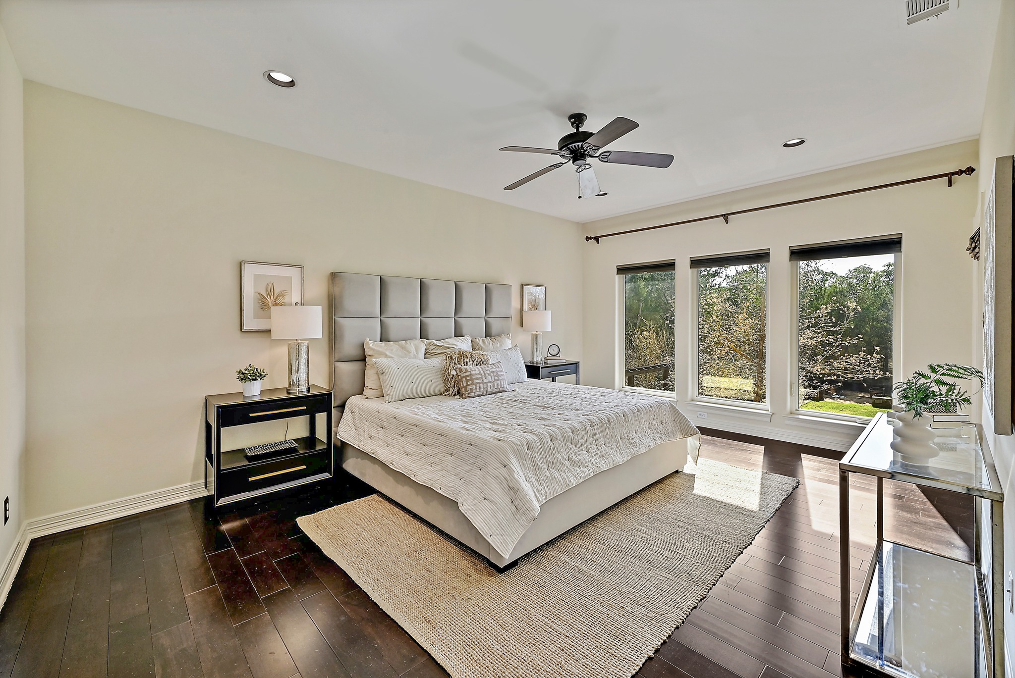 13201 Winding Creek Road Austin, TX 78736 - Photo 16 of 39 a bedroom with a large bed and a window