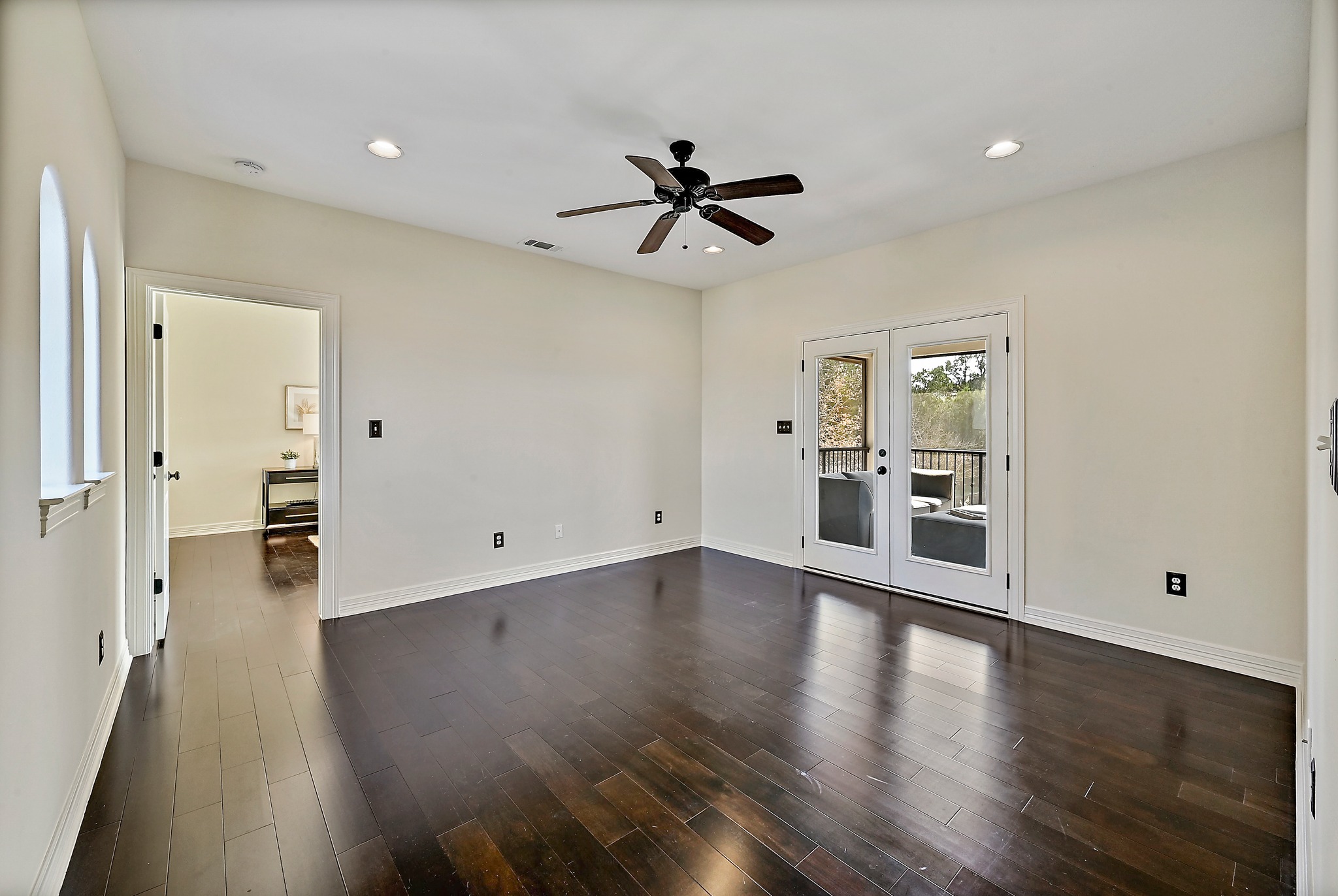 13201 Winding Creek Road Austin, TX 78736 - Photo 19 of 39 a view of empty room with wooden floor