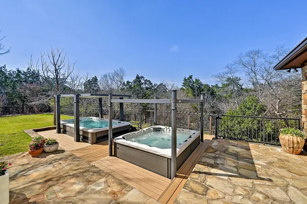 a view of a swimming pool with a patio and a yard