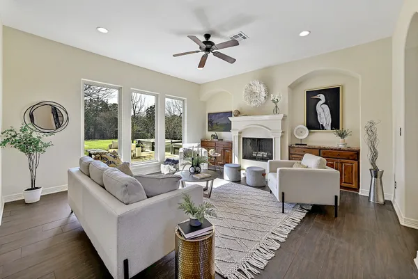 a living room with furniture and a fireplace
