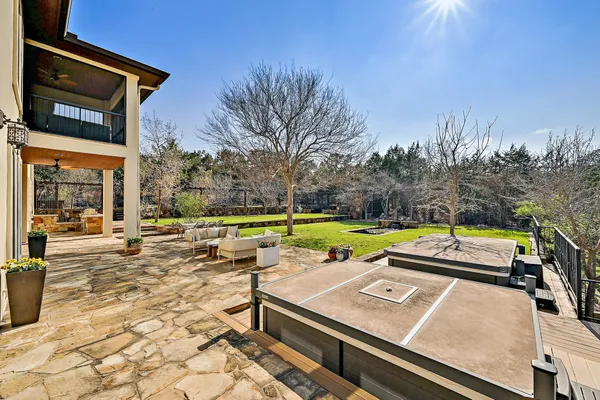 a view of a swimming pool with a patio