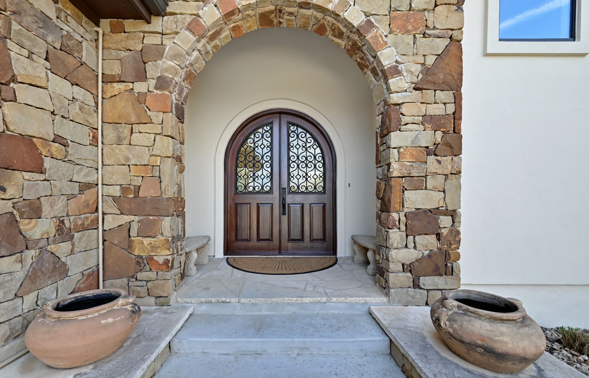 13201 Winding Creek Road Austin, TX 78736 - Photo 37 of 39 a front view of a house with a fountain
