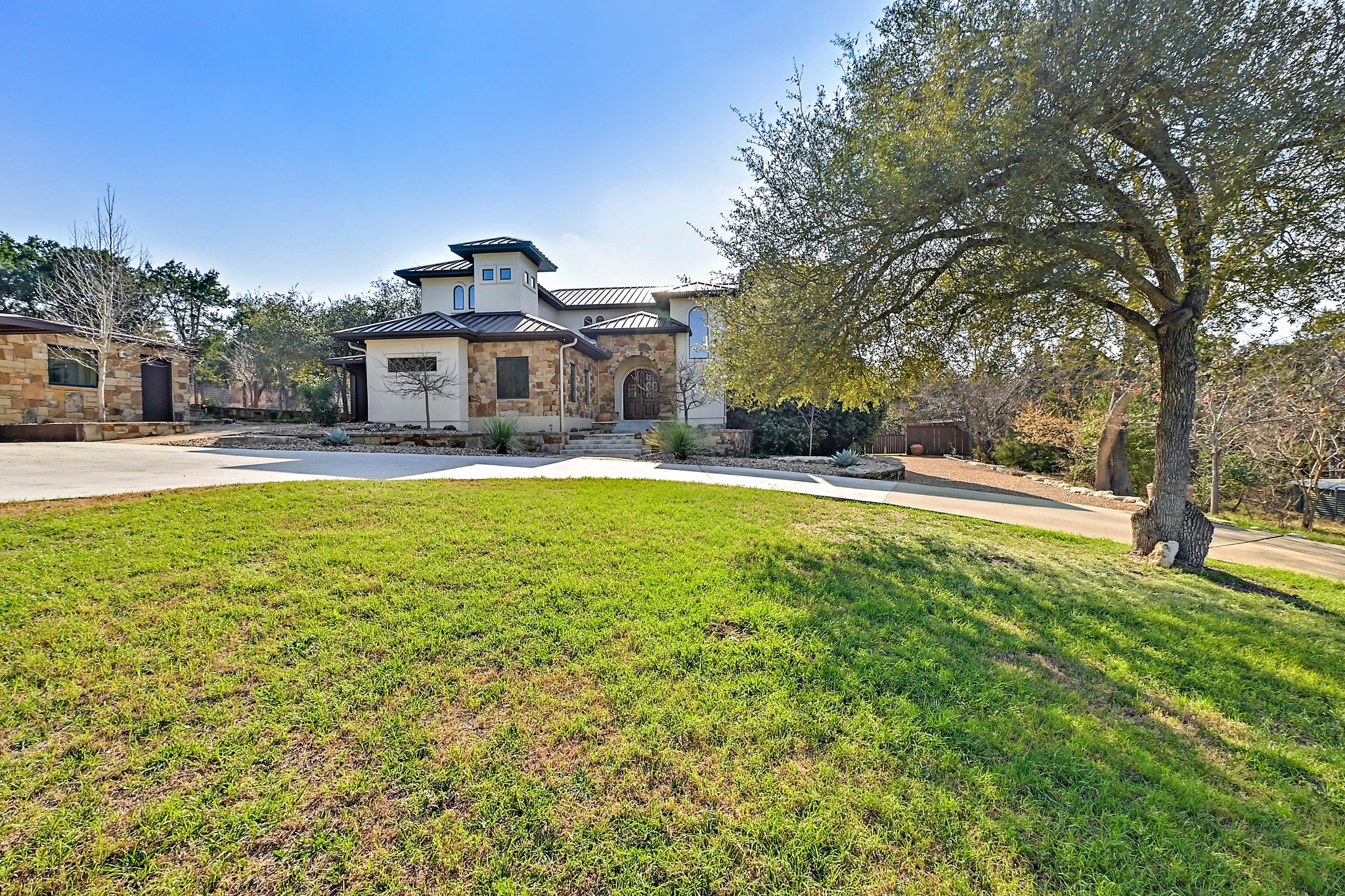 13201 Winding Creek Road Austin, TX 78736 - Photo 39 of 39 a view of a house with a big yard and large trees