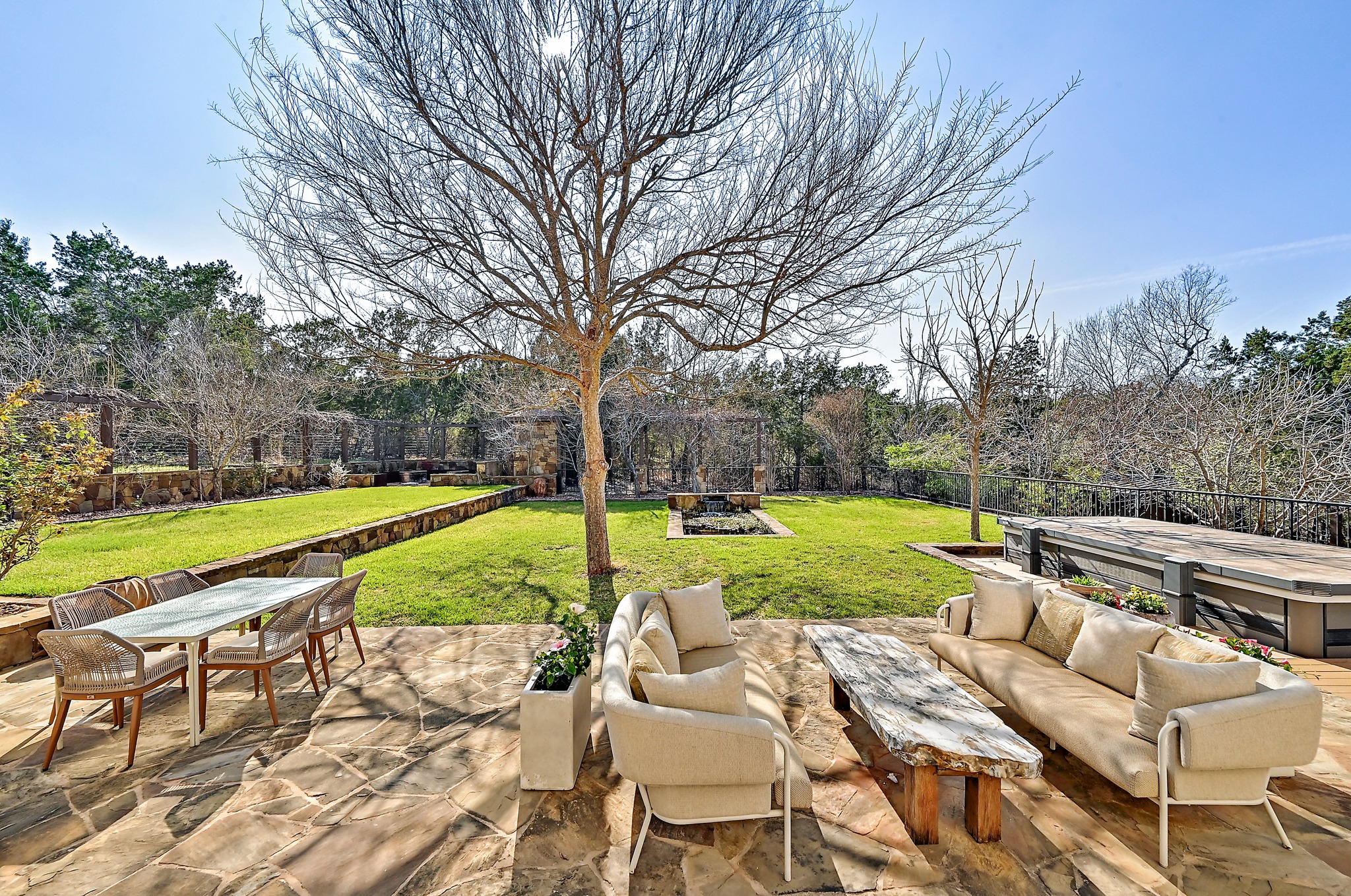 13201 Winding Creek Road Austin, TX 78736 - Photo 7 of 39 a view of backyard with swimming pool and outdoor seating