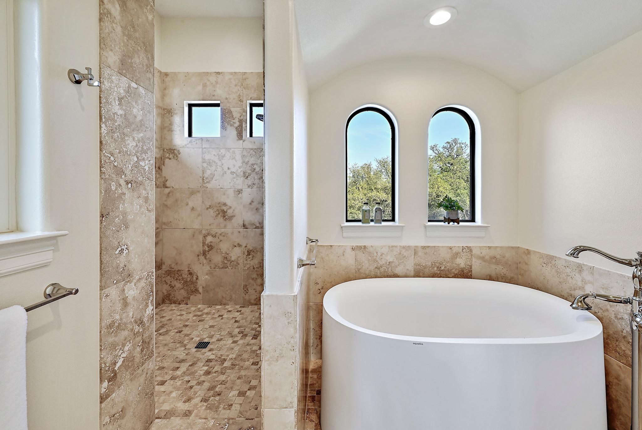 13201 Winding Creek Road Austin, TX 78736 - Photo 9 of 39 a white bath tub sitting next to a shower