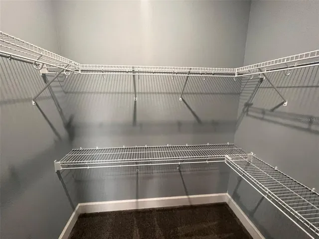 a view of a room with racks on the wall