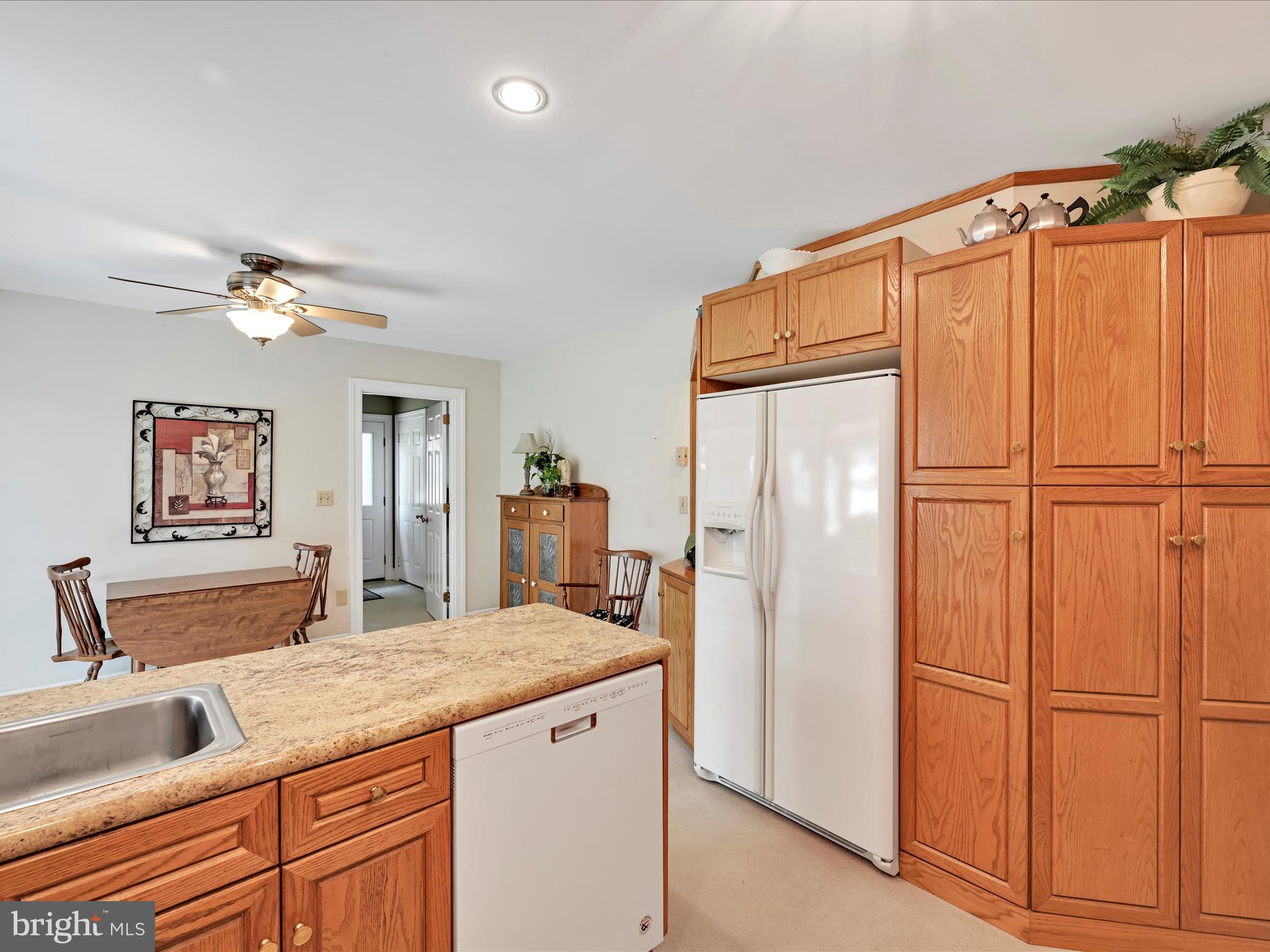 350 Indian Run Road Stevens, PA 17578 - Photo 15 of 72 a kitchen with stainless steel appliances granite countertop a refrigerator a sink and white cabinets