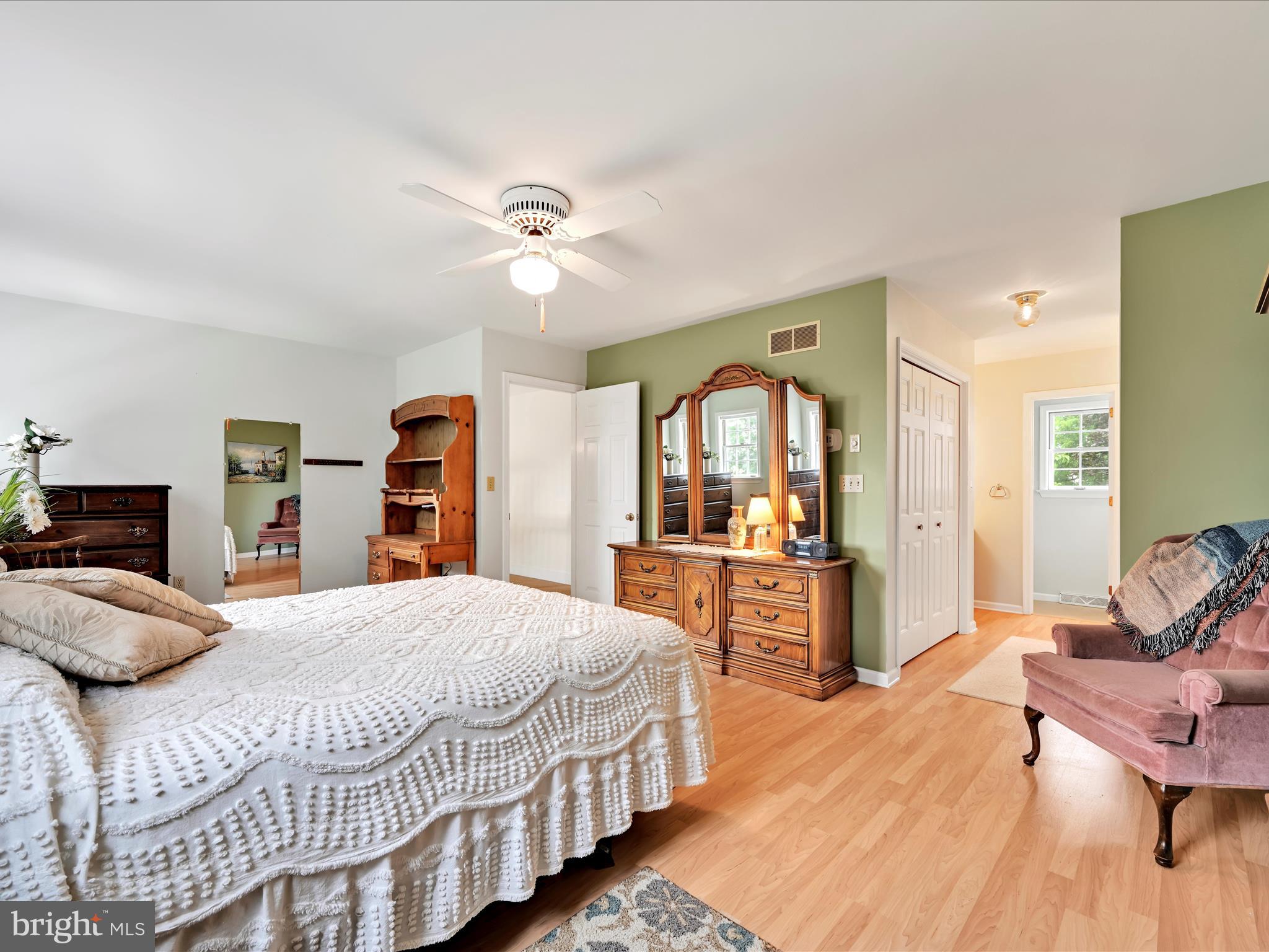 350 Indian Run Road Stevens, PA 17578 - Photo 24 of 72 a bedroom with a large bed a flat tv screen and dresser