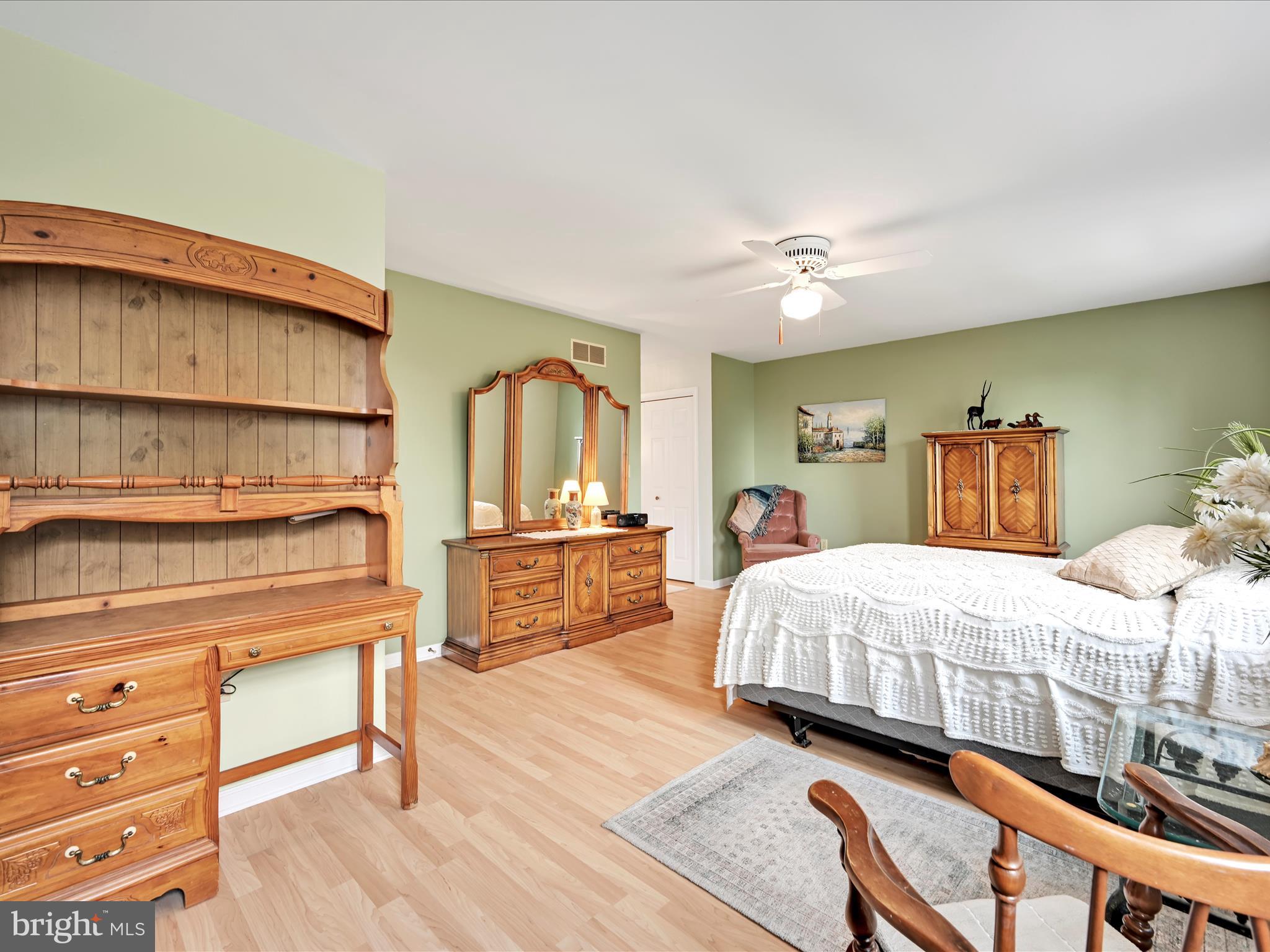 350 Indian Run Road Stevens, PA 17578 - Photo 25 of 72 a bedroom with a bed a dresser with wooden floor