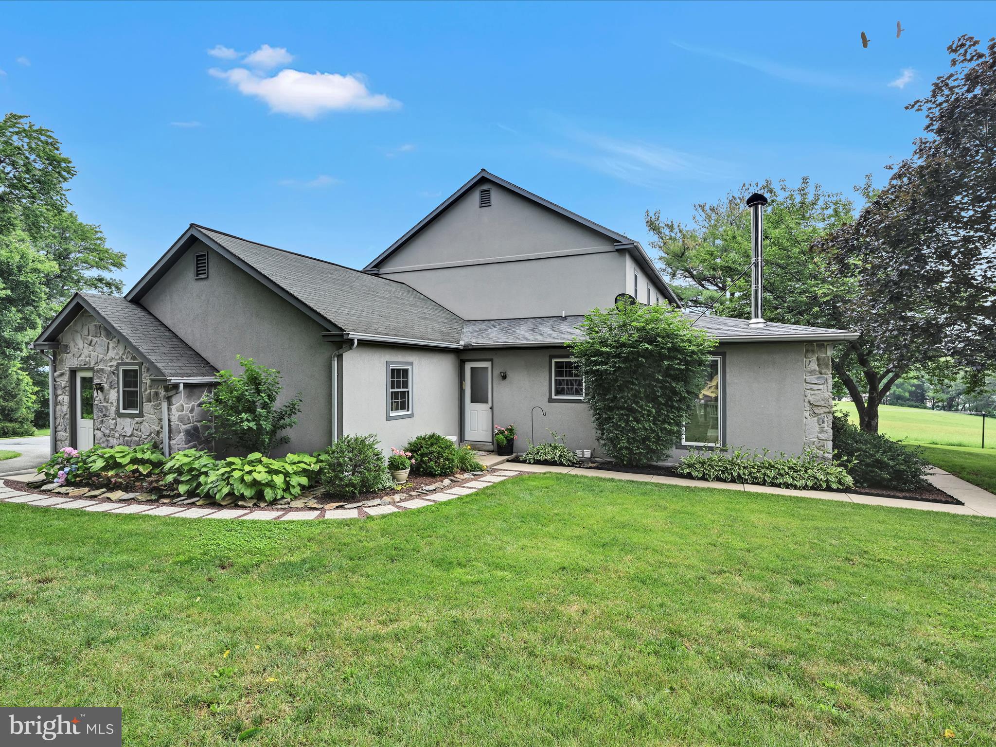 350 Indian Run Road Stevens, PA 17578 - Photo 44 of 72 a front view of house with a garden
