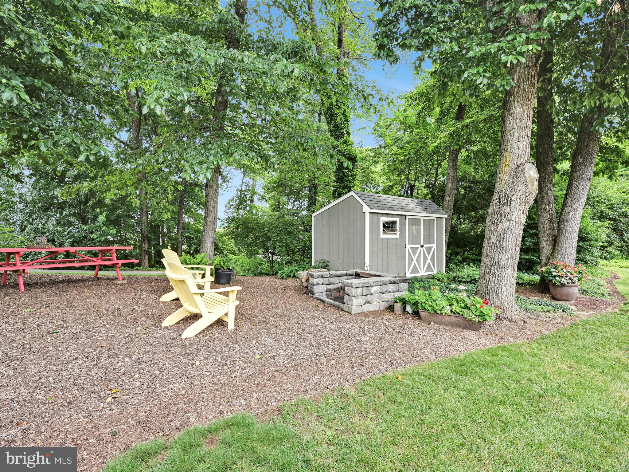 350 Indian Run Road Stevens, PA 17578 - Photo 45 of 72 a view of a backyard with table and chairs and a large tree