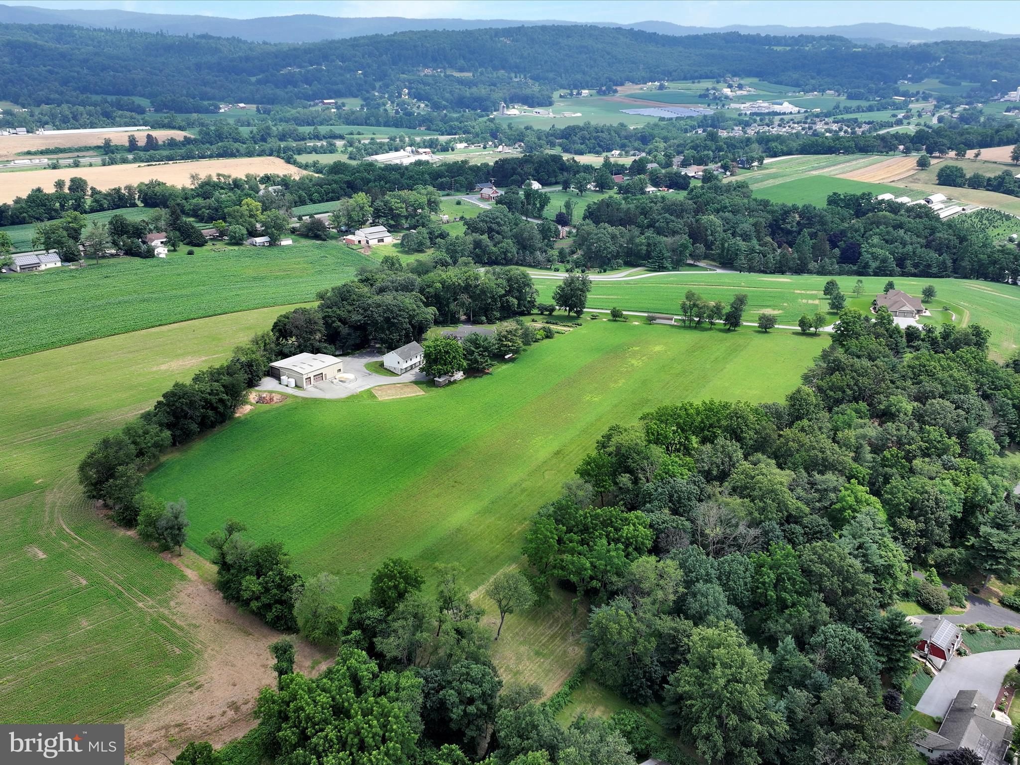 350 Indian Run Road Stevens, PA 17578 - Photo 59 of 72 an aerial view of green landscape with trees and houses
