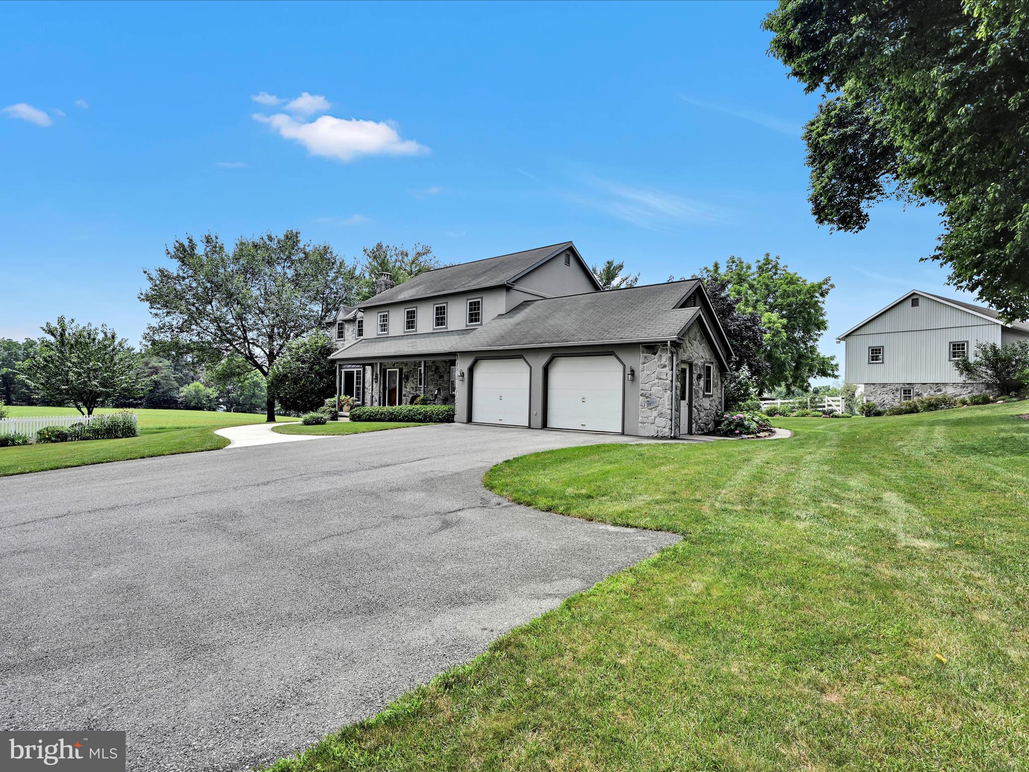 350 Indian Run Road Stevens, PA 17578 - Photo 6 of 72 a house with green field in front of it