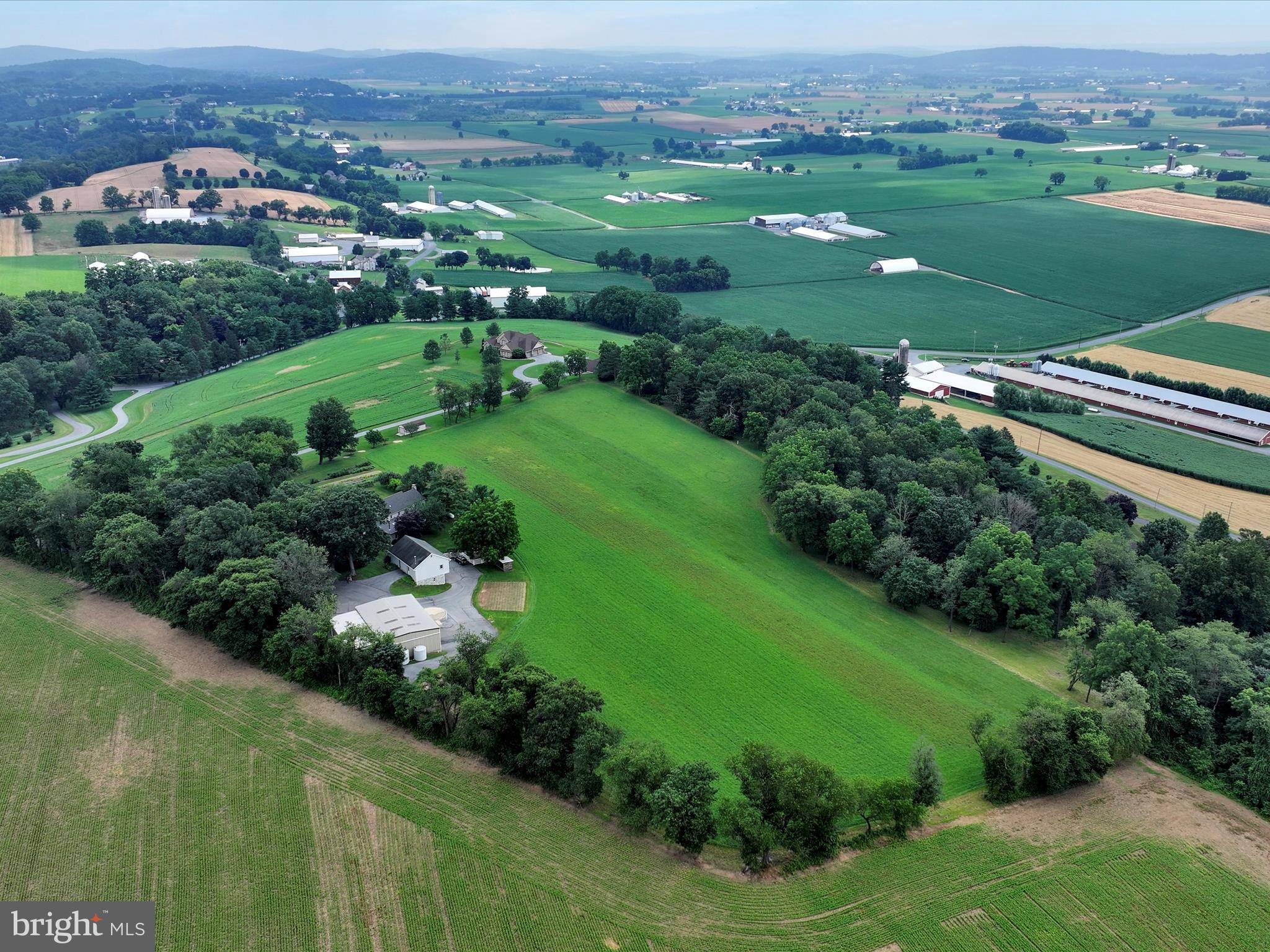 350 Indian Run Road Stevens, PA 17578 - Photo 62 of 72 an aerial view of green landscape with trees houses and lake view