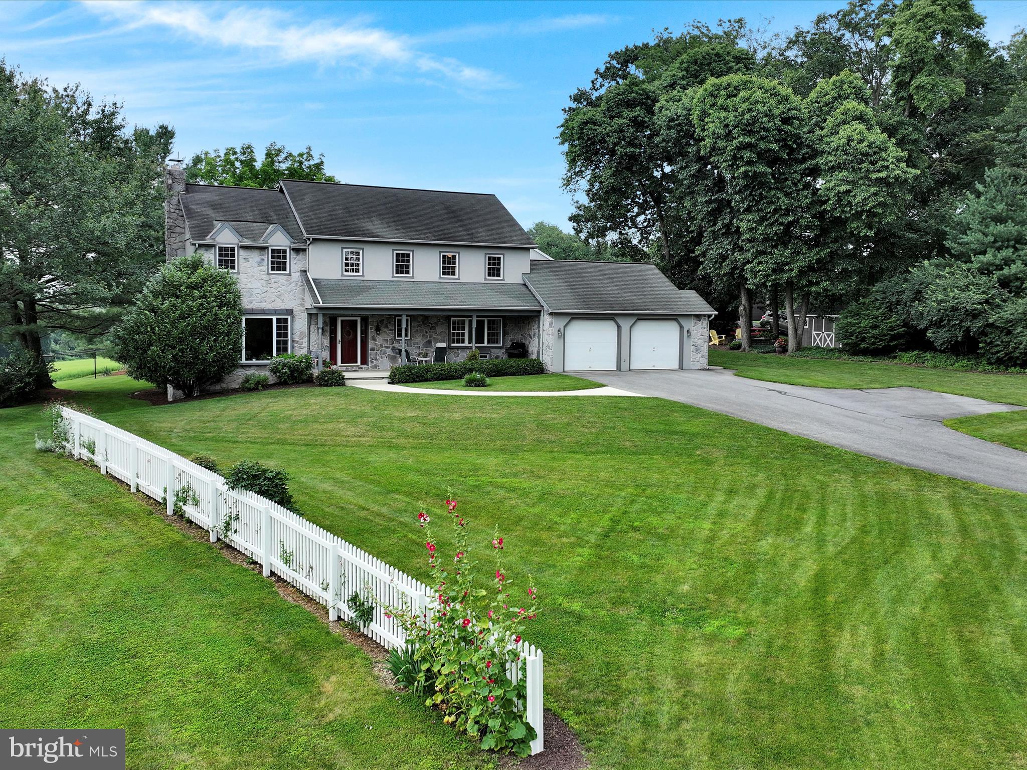 350 Indian Run Road Stevens, PA 17578 - Photo 67 of 72 a view of a big house with a big yard plants and large trees