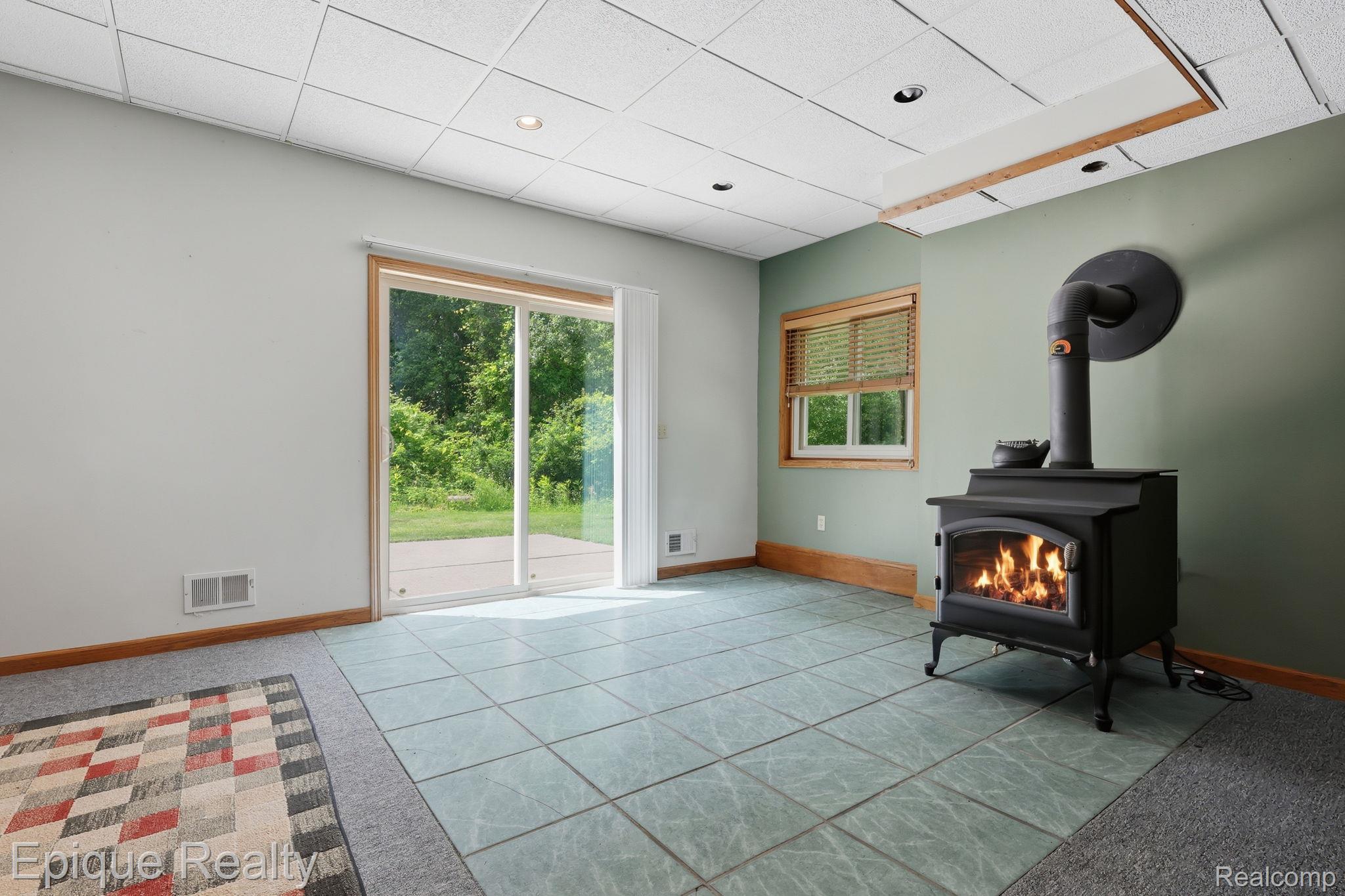 2348 Rochester Road Leonard, MI 48367 - Photo 23 of 31 23-web-or-mls-5Q6A4874 Phil Tuttle_with_fire.jpg
