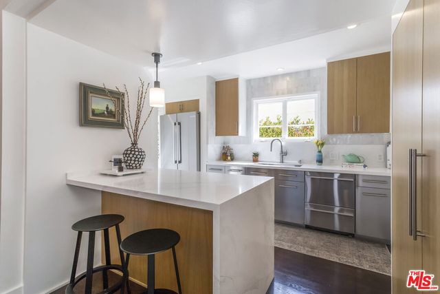 a bedroom with a large bed and a couch