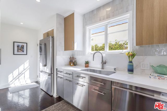 a bedroom with a bed a table and chair