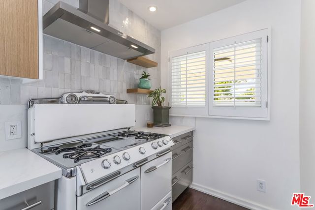 a bathroom with a sink a mirror and a shower